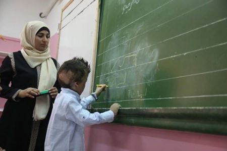 ألطفل دوابشة على مقاعد الدراسة مع بداية العام الدراسي الجديد